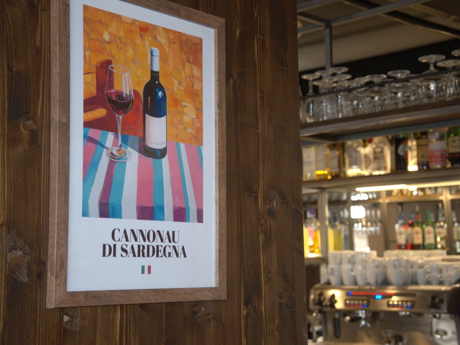 A Cannonau di Sardegna print on the wall beside the bar