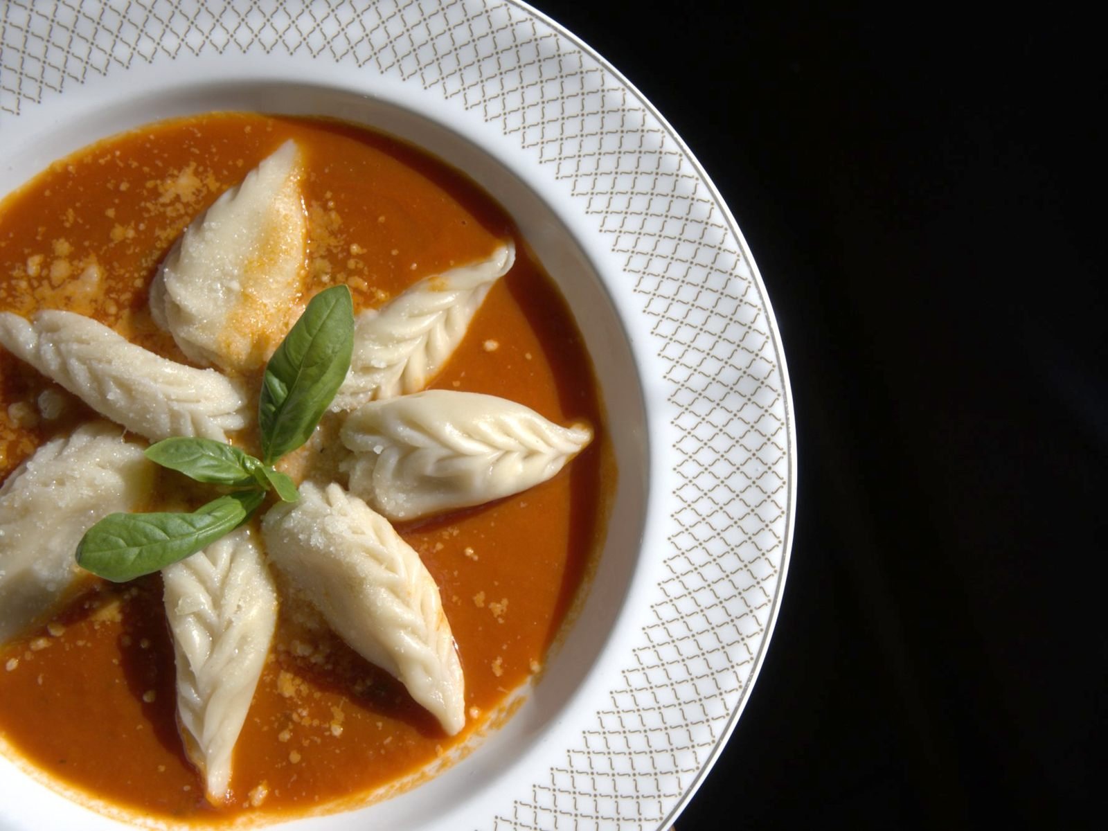 Culurgiones: hand-made Sardinian potato and pecorino dumplings in tomato sauce with basil